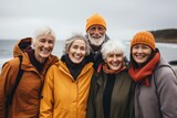 Portrait of diverse senior people on the cold beach