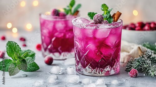 Pink cranberry cocktail with festive background.