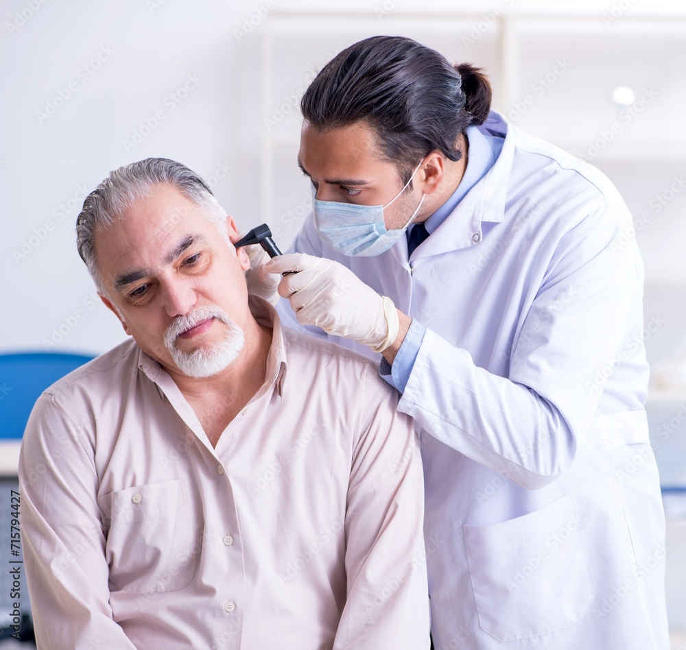 Male patient visiting doctor otolaryngologist Male patient visiting doctor otolaryngologist