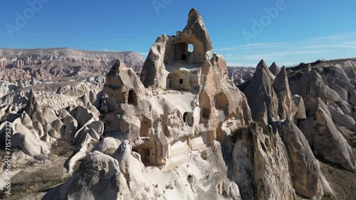 Aerial drone view of the famous Rock Sites of Cappadocia, Turkey. This old settlement is located in the rose red valley in Goreme.