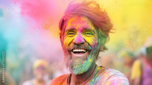 cheerful elderly bearded man reveling in holi festivities, splattered with rainbow powders, outdoor jubilation, festival, powder face, colorful powder in air.