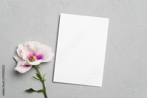 Blank greeting or invite card mockup with flowers, white card mock up with copy space