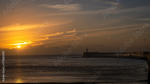 Newhaven Harbour with lighthouse at sunrise © Z Fiedler
