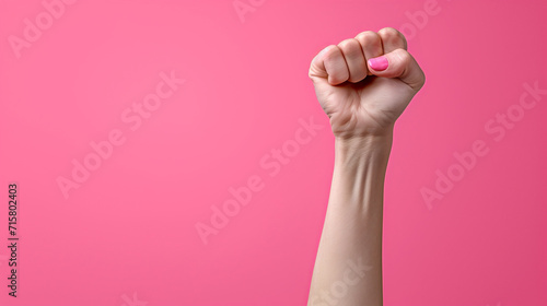 Power and Beauty: Woman's Fist Against Pink Background - Women's Day
