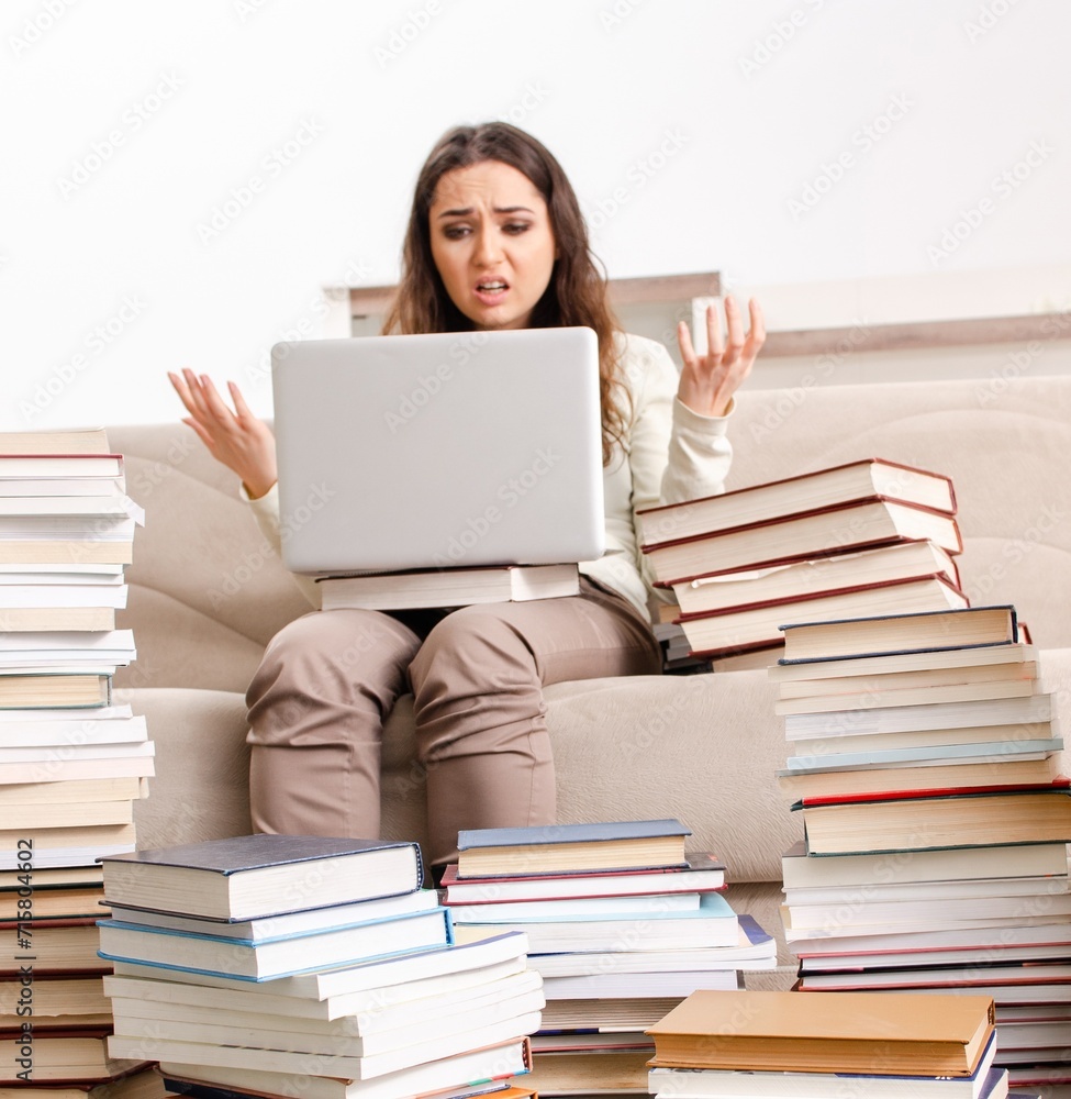 Young female student preparing for exams at home Young female student preparing for exams at home