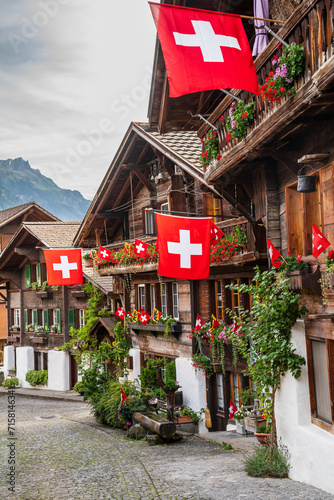 swiss flags with wooden houses