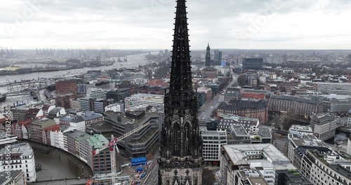 Nikolaiturm, The Sankt Nikolaikirche close up, in the background. Urban city views in the center of Hamburg, including historic buildings and landmarks. photo