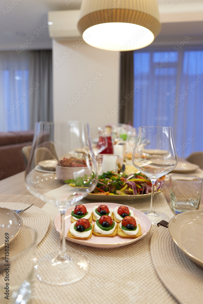 Fototapeta premium Table served for festive dinner in living room