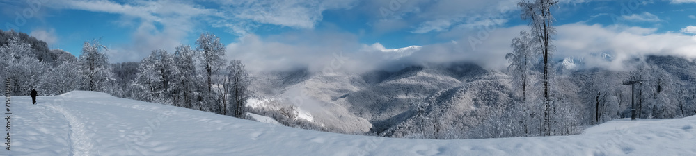 winter landscape with mountains. Panorama of snow-capped mountains.
  Travel concept, winter vacation.