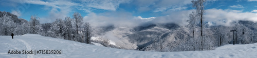 winter landscape with mountains. Panorama of snow-capped mountains.   Travel concept, winter vacation. © Natali9yarova