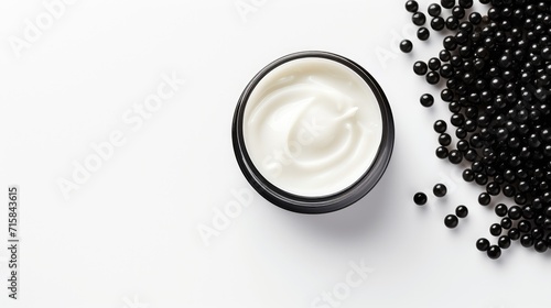 Caviar luxury cream skincare. Jar of face cream with black caviar extract on white background. 