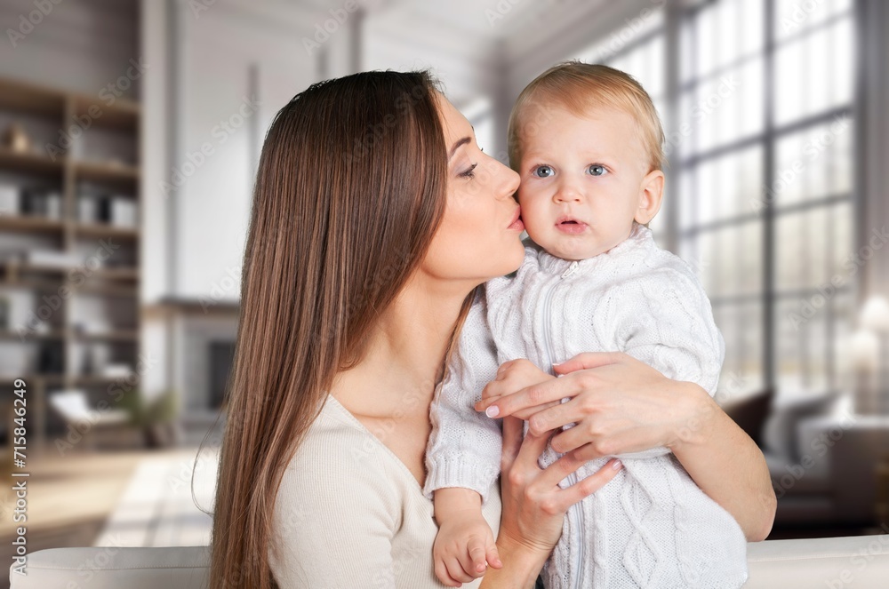 portrait of beautiful mother kissing her child portrait of beautiful mother kissing her child