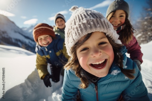 group of jubilant children plays in the pristine snow, their laughter and joy matching the sparkling winter landscape around them © gankevstock