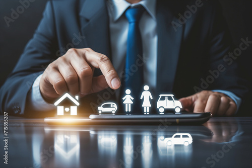 Businessman pointing Insurance Concept Icons to select Insurance Services for Home, Car, and Life on Digital Platform