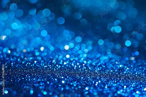 Sapphire glitter bokeh background. Unfocused shimmer royal blue sparkle. Crystal droplets wallpape