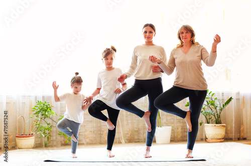 Multi generational family doing yoga together
