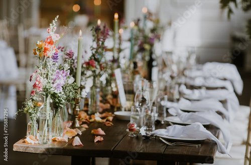 Wedding Top Table with colourful flowers and candles 