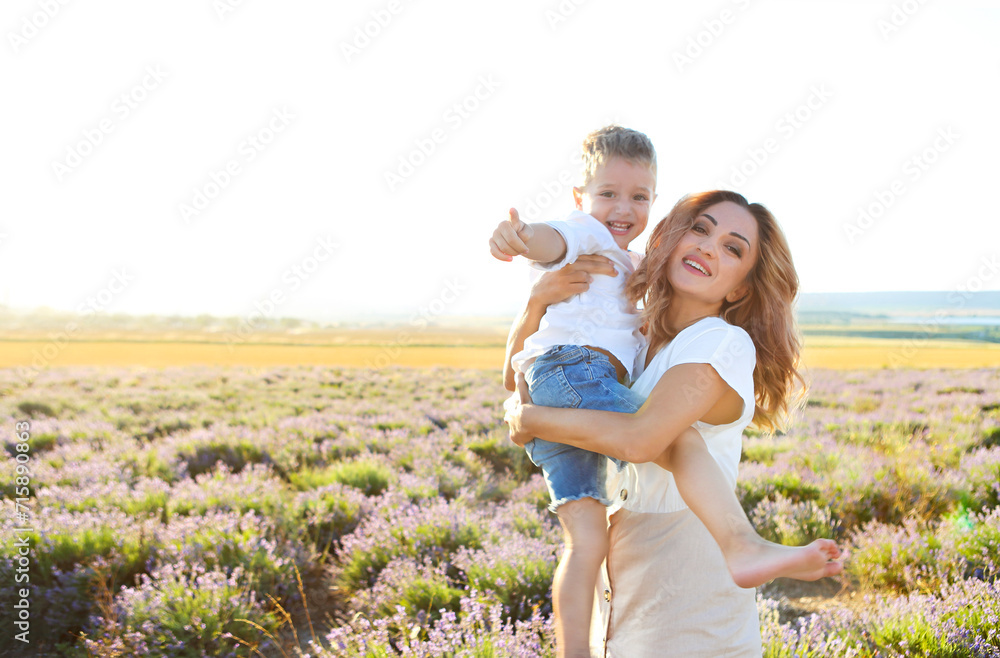 Happy young mother and her little in lavender field Happy young mother and her little in lavender field
