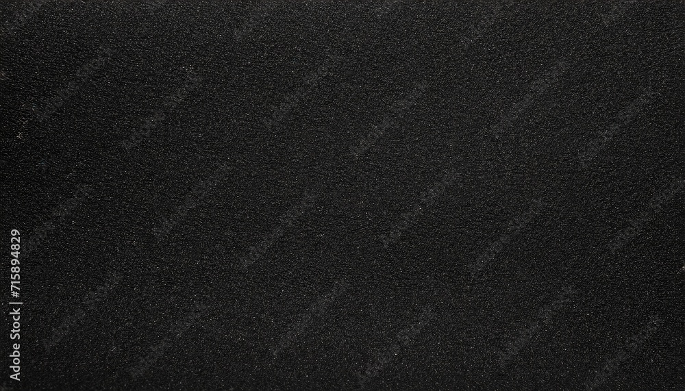 black sandpaper texture background close up