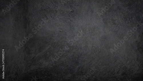black or dark gray rough grainy stone or sand plaster texture background