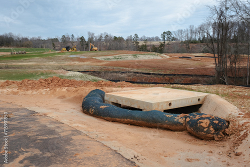 Storm drain surrounded by a filter sock to prevent erosion runoff in new subdivision photo