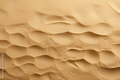  a close up of a sand dune textured with wavy lines and a small amount of sand in the foreground. © Shanti