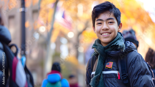 Portrait of smiling young Asian student against blurred background of American learning center. Banner