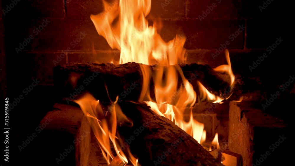 Home cozy fireplace with red flame and birch firewood. 4K video relaxing endless footage Home cozy fireplace with red flame and birch firewood. 4K video relaxing endless footage