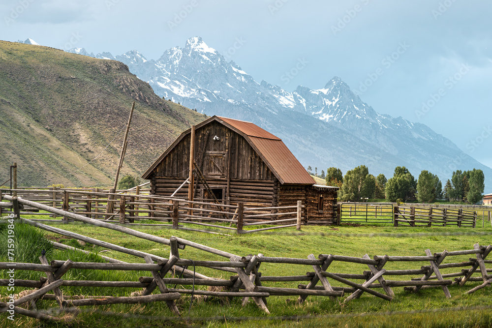 Barn in Jackson Hole, Wyoming, USA with Teton Mountain range in the background. June 6, 2023. Barn in Jackson Hole, Wyoming, USA with Teton Mountain range in the background. June 6, 2023.