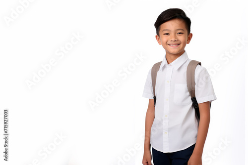 Asian chinese school boy with backpack over white background. Middle school smiling at camera Back to school. Copy space for advertising blank. Childhood, education, products for children