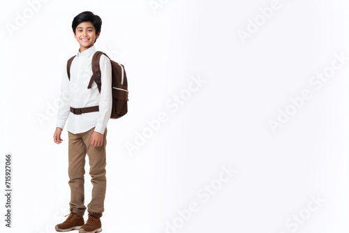 Middle-eastern school boy with backpack over white background. Middle school smiling at camera Back to school. Copy space for advertising blank. Childhood, education, products for children photo