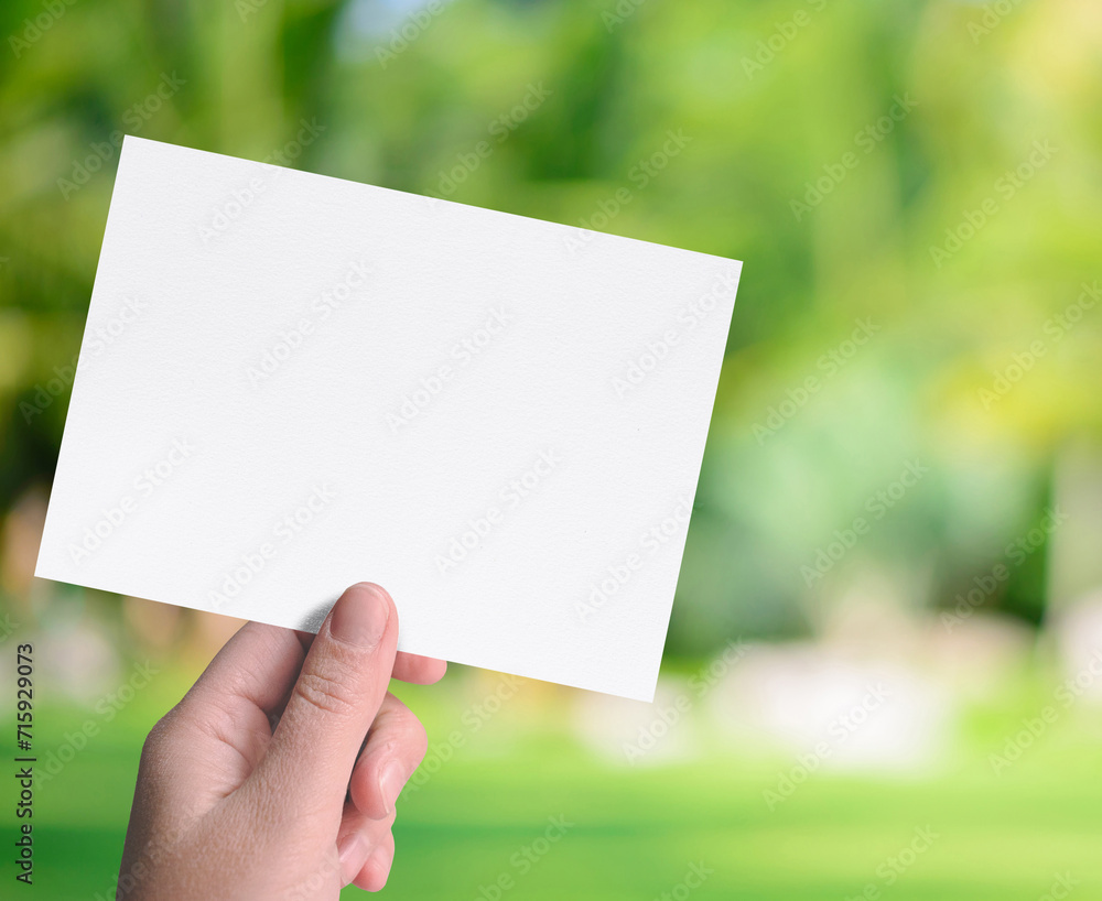Man hand holding a invitation card isolated. Man hand holding a invitation card isolated.