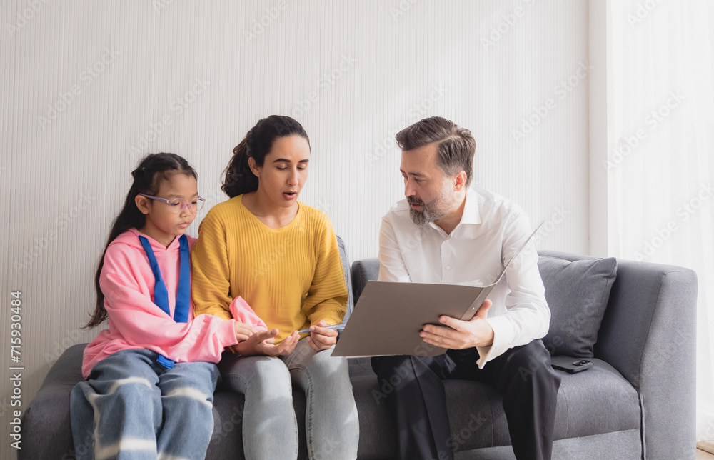 Portrait latin woman and daughter sit sofa with man business caucasian sitting two pason talk giving advice and think analyze look insurance, investment and financial documents in agreement in room Portrait latin woman and daughter sit sofa with man business caucasian sitting two pason talk giving advice and think analyze look insurance, investment and financial documents in agreement in room