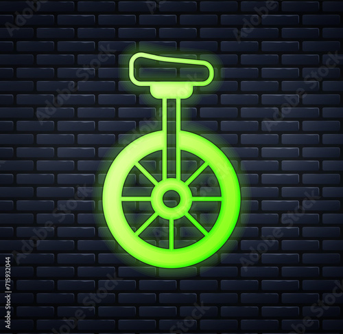 Glowing neon Unicycle or one wheel bicycle icon isolated on brick wall background. Monowheel bicycle. Vector