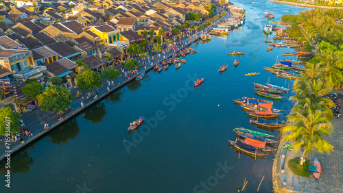 Aerial drone view of Hoi An city during a sunset in Vietnam. Ancient town, UNESCO world heritage, at Quang Nam province.  photo