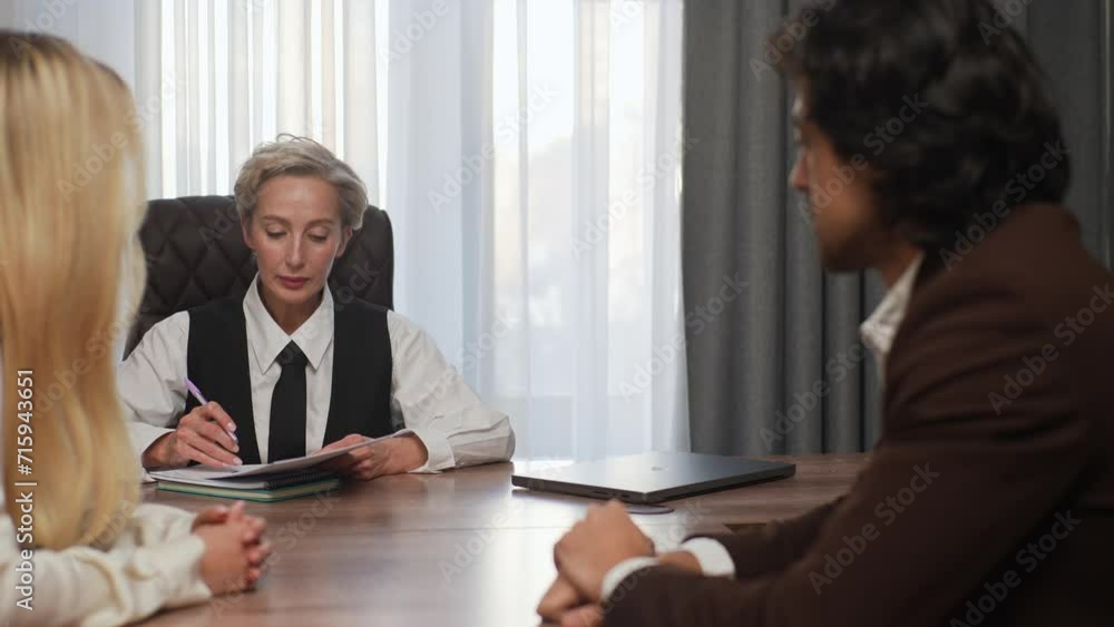 custom made wallpaper toronto digitalProfessional middle-aged businesswoman investment advisor lawyer financial expert consulting clients young couple holding document contract, negotiating explaining bank loan deal benefits