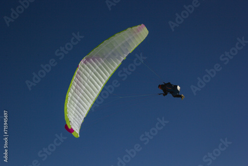 Paraglider flying. Blue sky. 