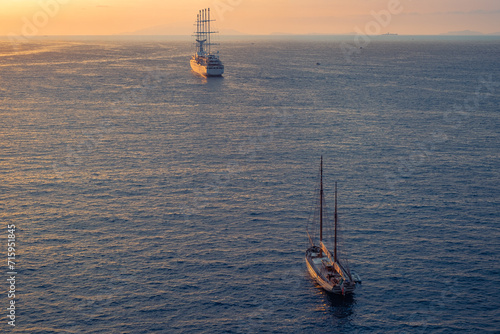 Two Sailing Ships In The Sea On Sunset