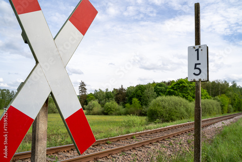 St andrew cross with railroad tracks in landscape