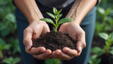a pair of hands holding a small amount of dark brown soil with a young green plant sprouting from it. The image represents the importance of nurturing and caring for nature.