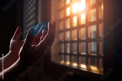 Hand of  muslim praying person with mosque interior