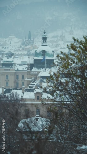 landscape in winter in Prague, Czech Republic with Straka Academy dome in the evening. photo