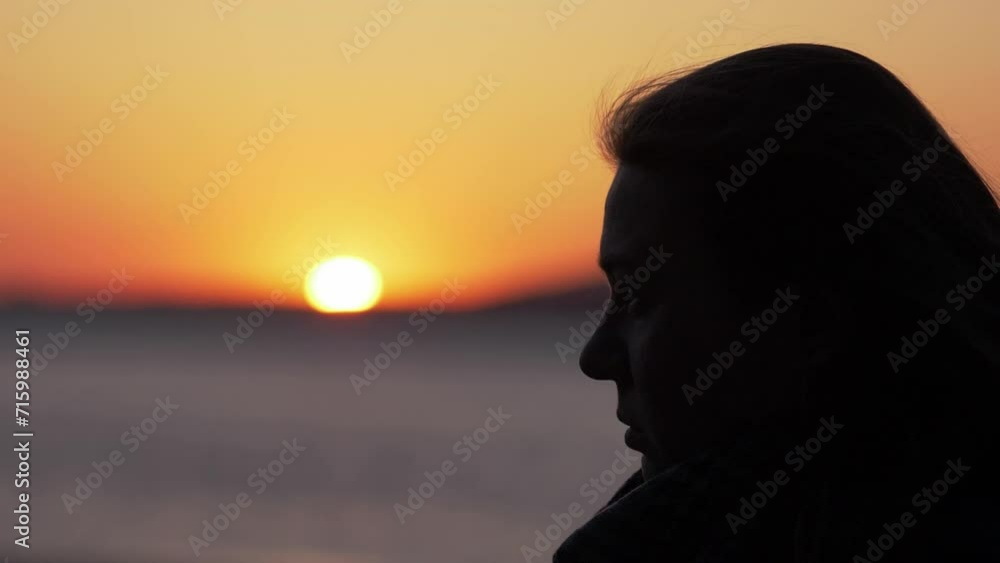 Silhouette of Thought: Woman at Sunset, Profile View Silhouette of Thought: Woman at Sunset, Profile View