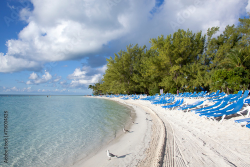 Fototapeta Naklejka Na Ścianę i Meble -  Little Stirrup Cay Island Beach With Seagulls And Empty Chairs