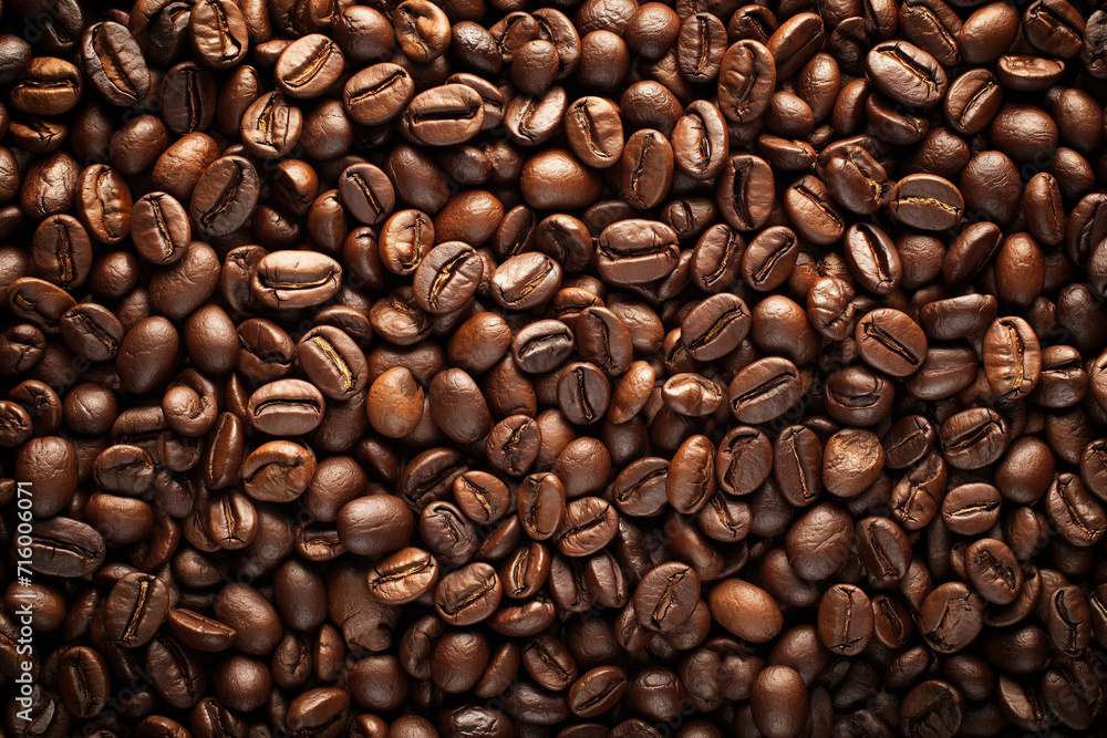 a lot of coffee beans lying on top of each other, for the background, a top-down perspective a lot of coffee beans lying on top of each other, for the background, a top-down perspective