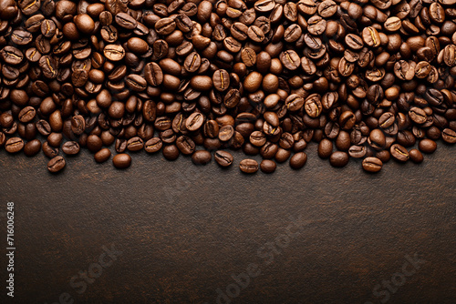 a lot of coffee beans lying on top of each other  for the background  top view  empty space from below
