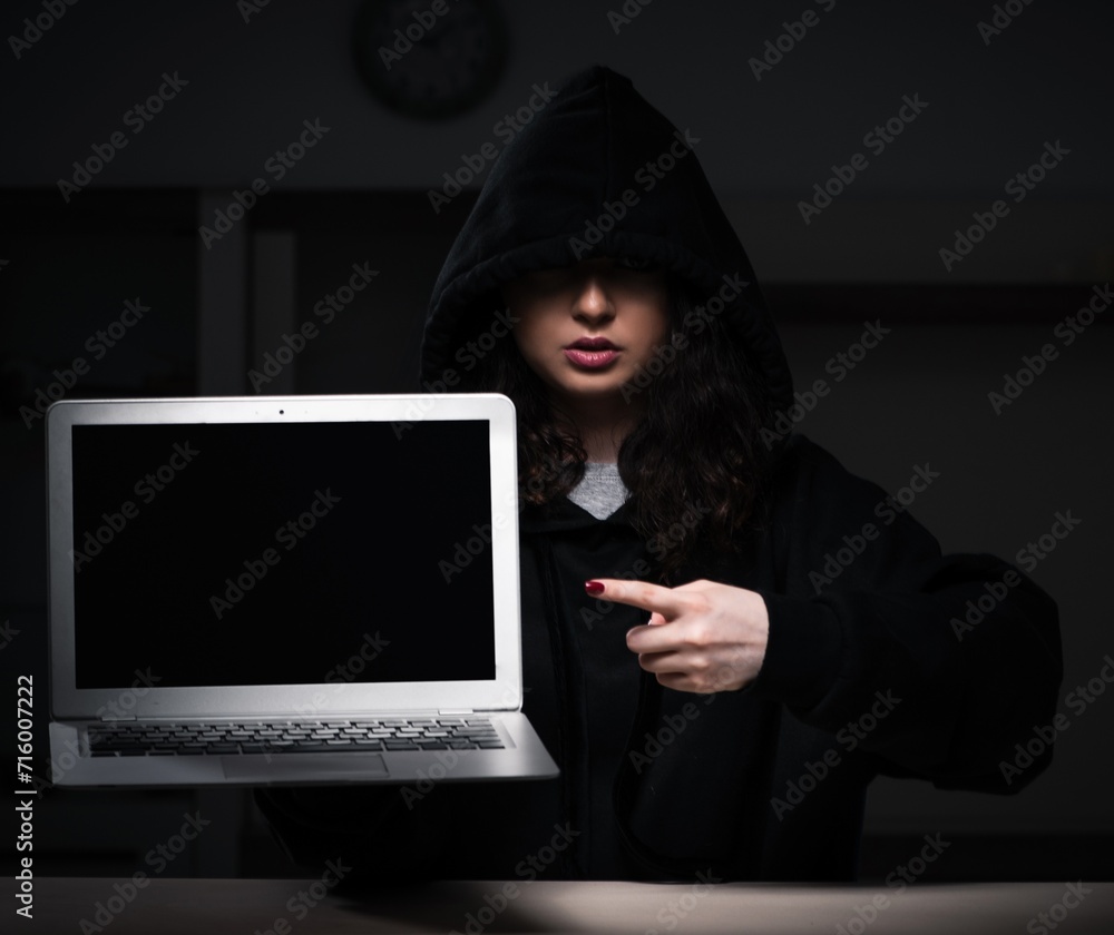 Female hacker hacking security firewall late in office Female hacker hacking security firewall late in office