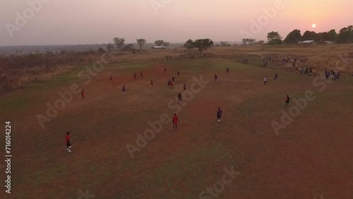 Children play football in Africa. Drone view photo