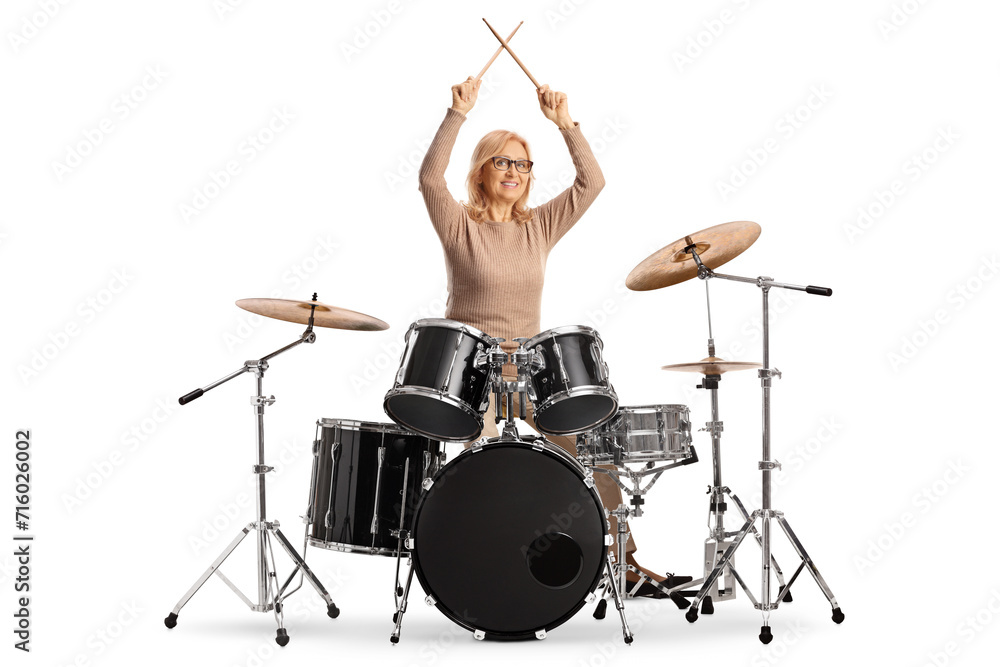 Fototapeta premium Woman playing drums isolated on white background