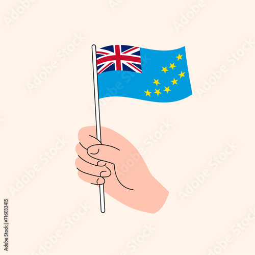 Flag of Tuvalu, Oceania, Isolated Flat Illustration. Cartoon Hand Holding Tuvaluan Flag, Simple Vector Design.  © itsmaku